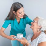 pretty-helpful-carer-talking-with-female-patient